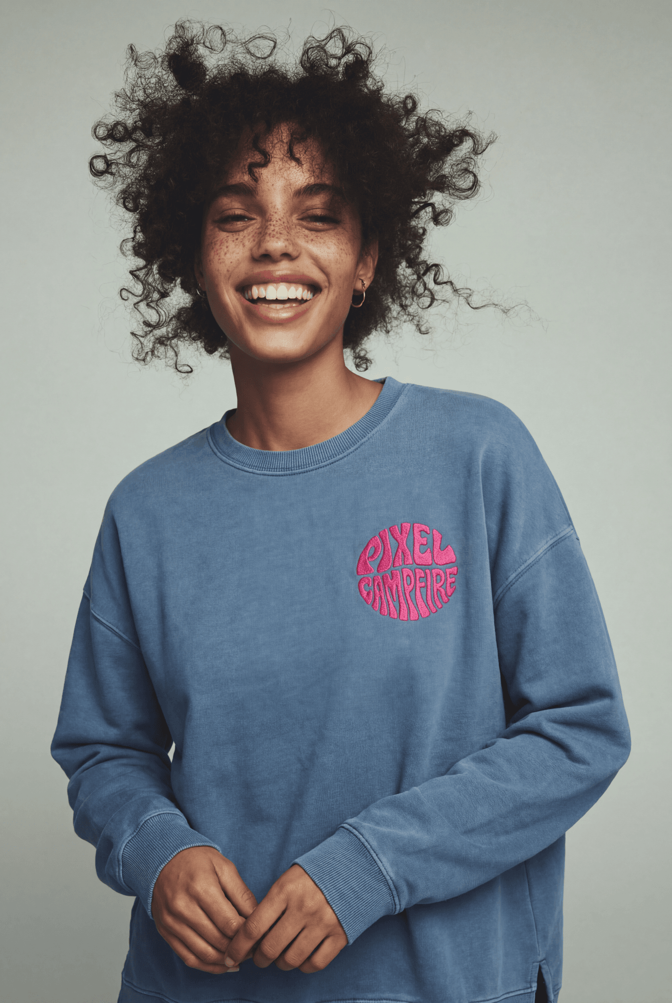 Creator wearing premium crewneck