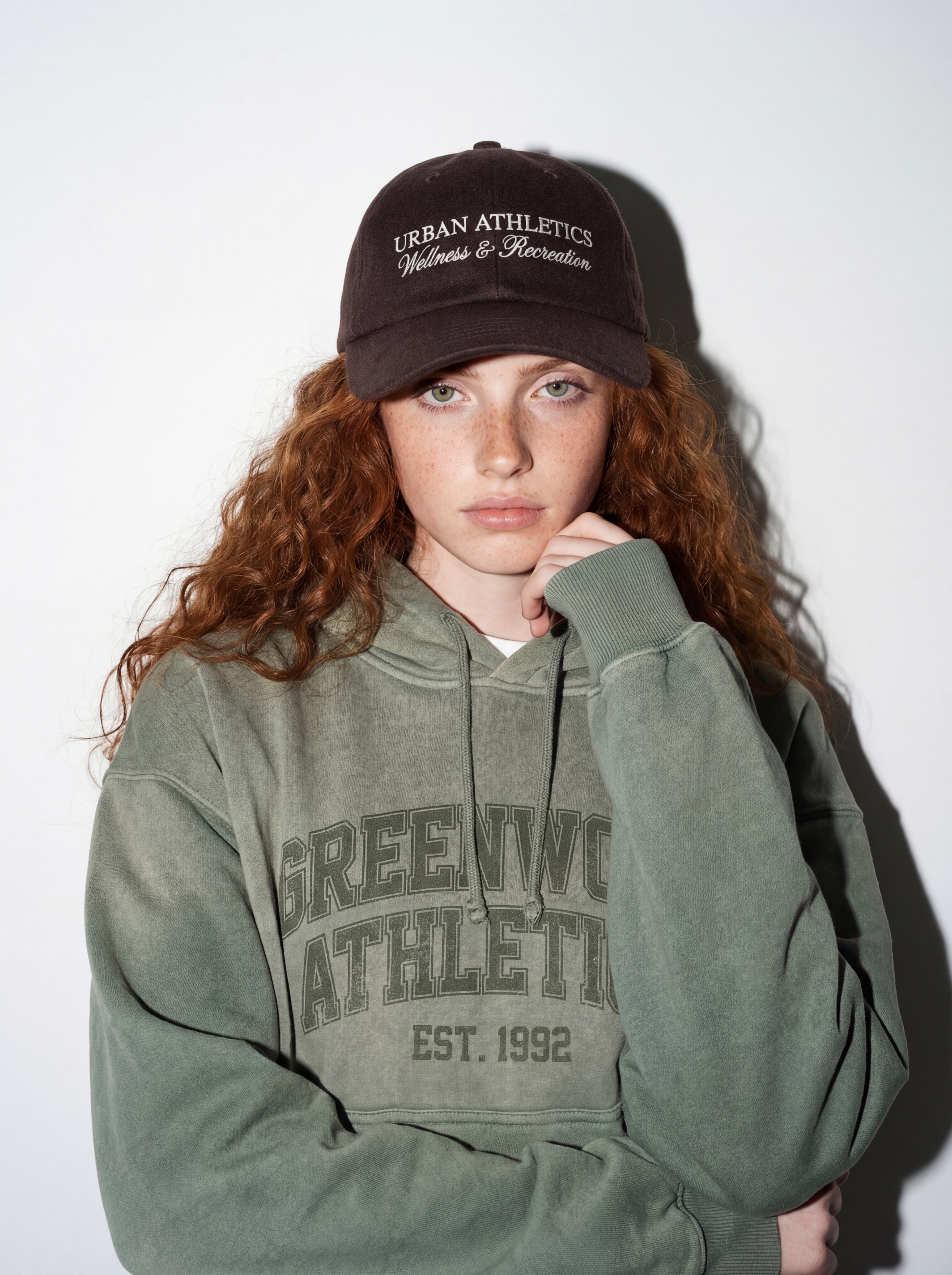 Creator wearing Greenwood Athletics hoodie and cap